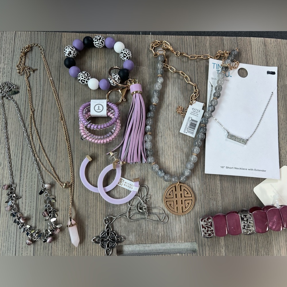 Purple silver and Gold toned new and used jewelry lot